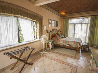 Munecas Suite, with double boveda ceilings and view to the pool and park