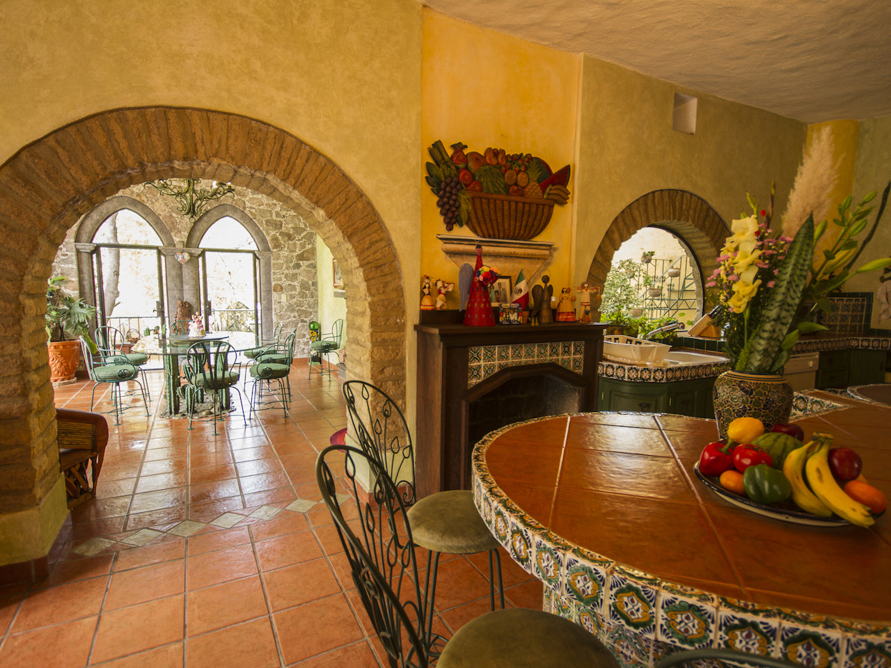 La Casa de la Rosa Rosa, the first and main villa, 4 suites, 8 guests.. Dining areas seen from Kitchen ; Private pool and pool terraces